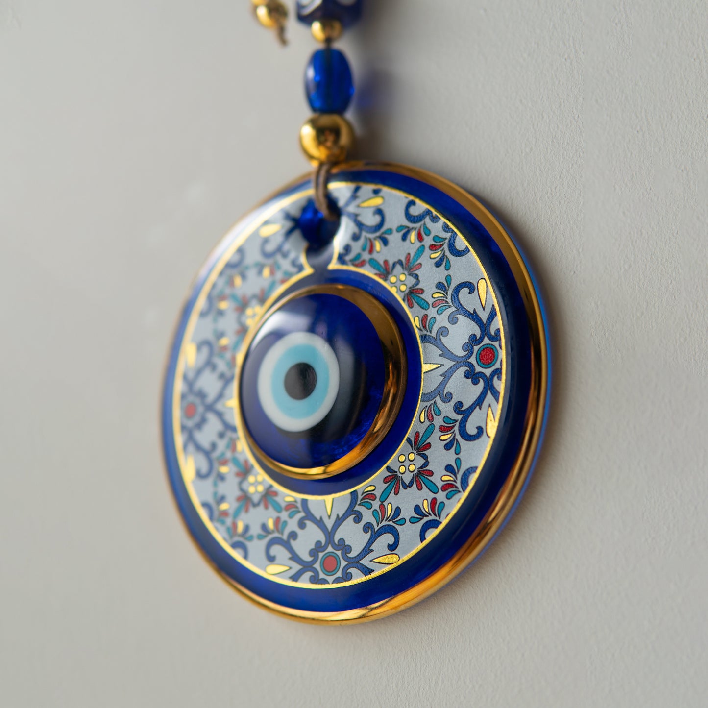 Geometric Patterned Gold Evil Eye Bead